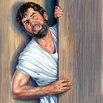 A man exerts himself vigorously to get in through a narrow door