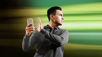 A brother turning away from something inappropriate on his smartphone.