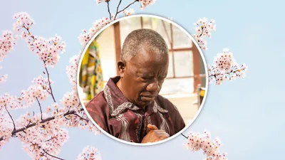 An elderly brother praying.