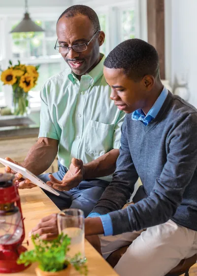 A father and son look at jw.org together