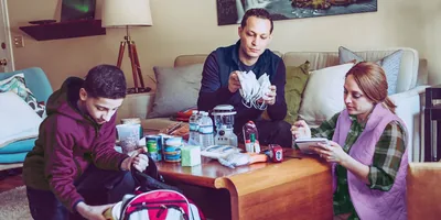 A family preparing their emergency kits.