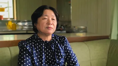 A scene from the video “Successful Fighters for the Faith​—Those With Unbelieving Mates.” Sister Tomoe Okada.