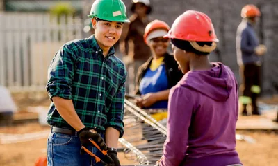 Young brothers and sisters in construction service