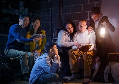 During the great tribulation, a few families study the Bible together in their basement